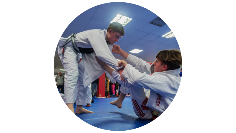 kids learning Brazilian Jiu-Jitsu in class